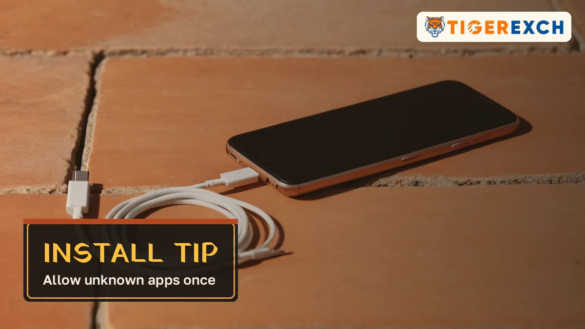 Install tip card, allow unknown apps once, over a phone with a charging cable on stone